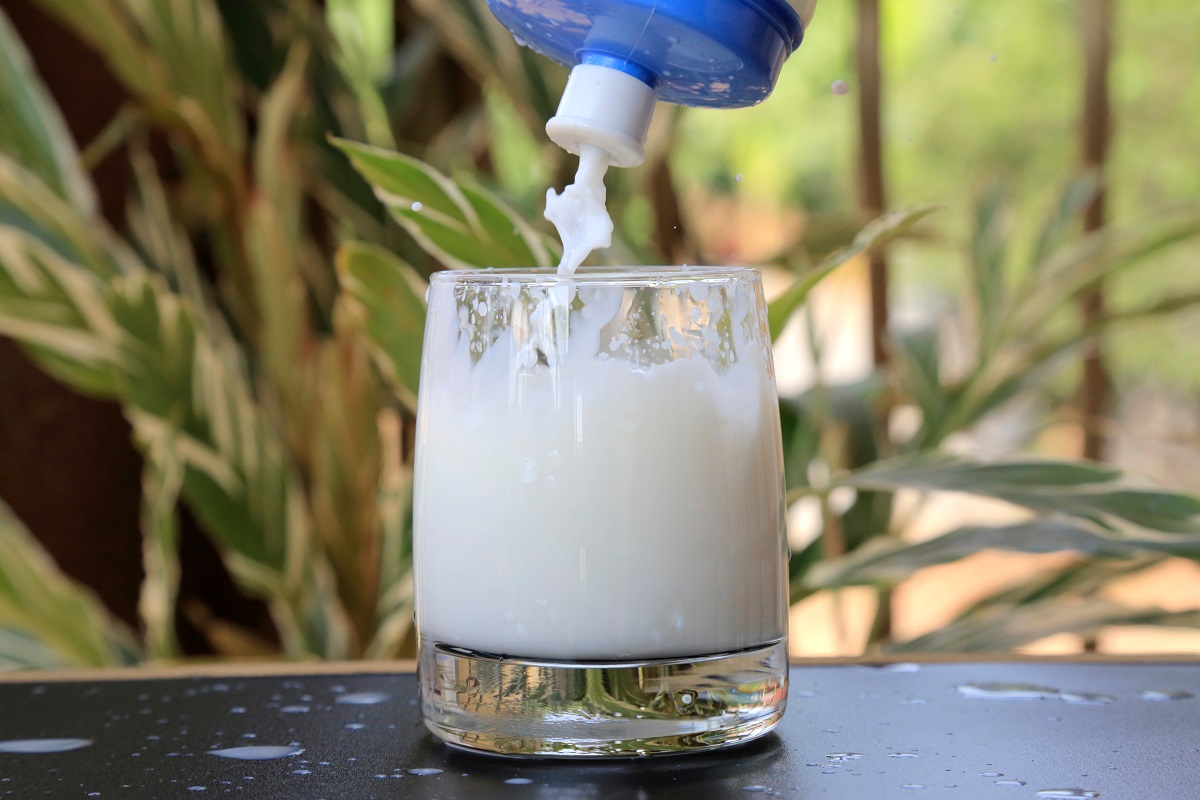 milk being poured into glass