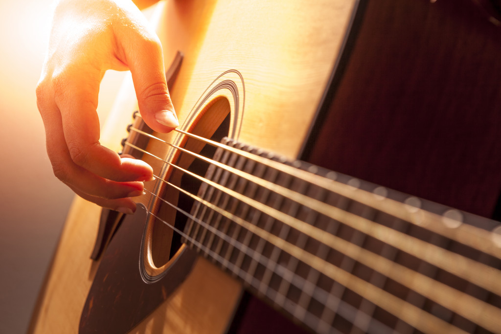 man playing a guitar