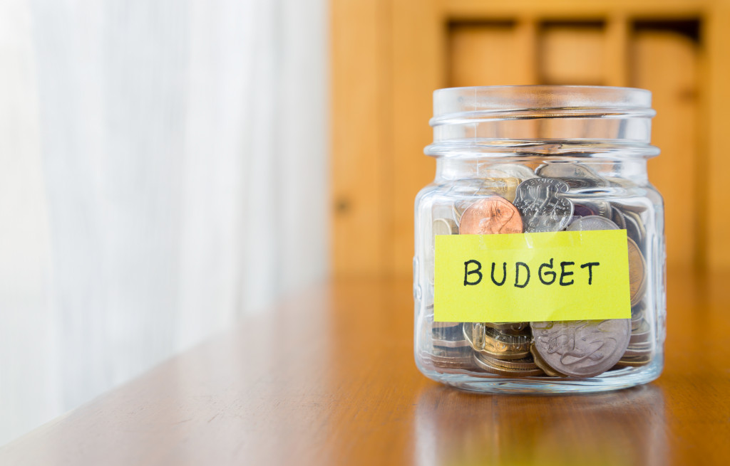 coins in a jar with budget label