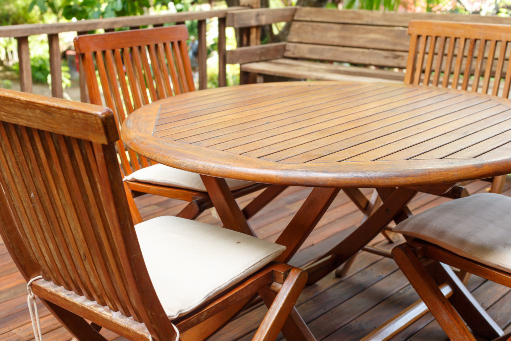 a wooden furniture set outdoors