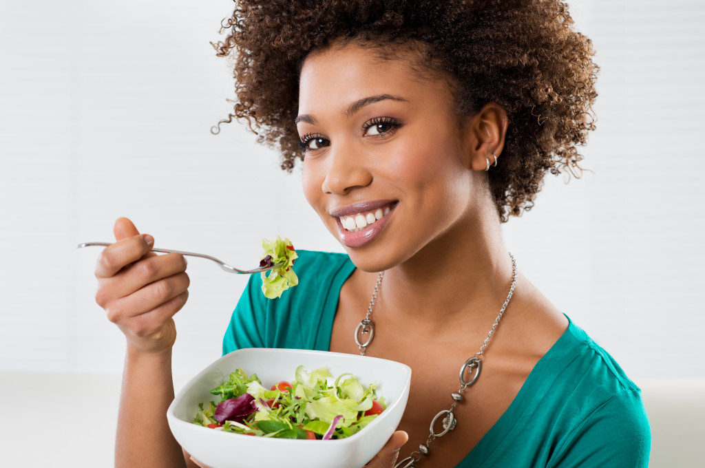 Woman eating salad