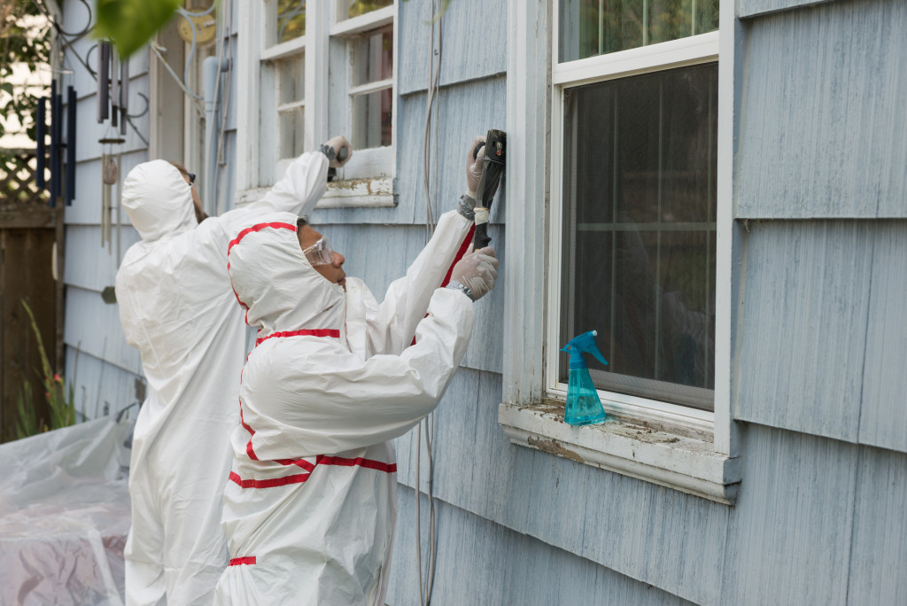 experts removing paint from the wall