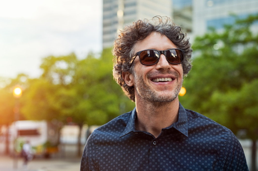 A man outdoors wearing sunglasses