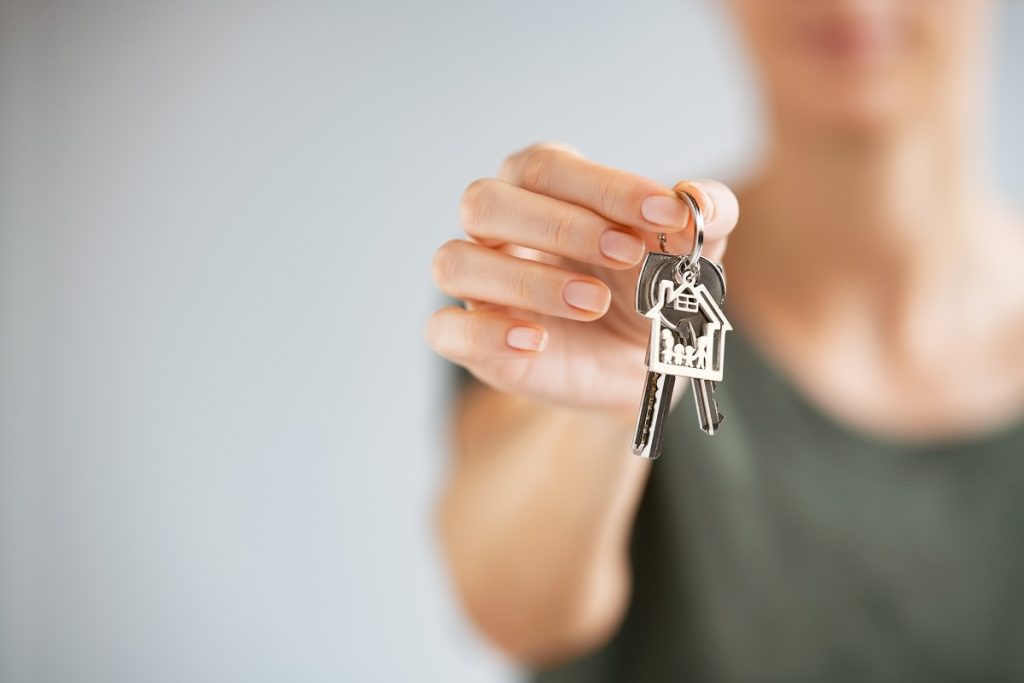 woman holding house key