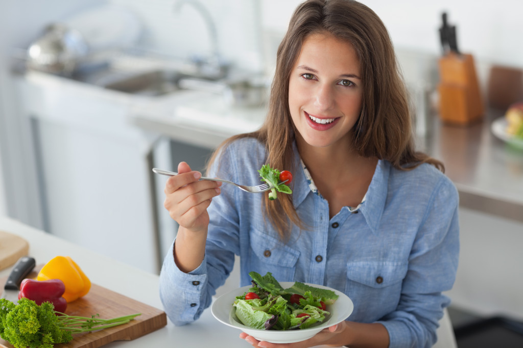  eating a salad in the kitchen