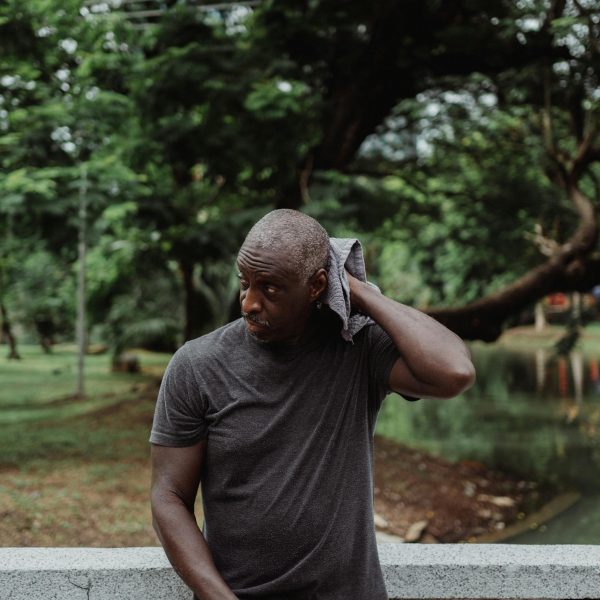 Man wiping his sweat